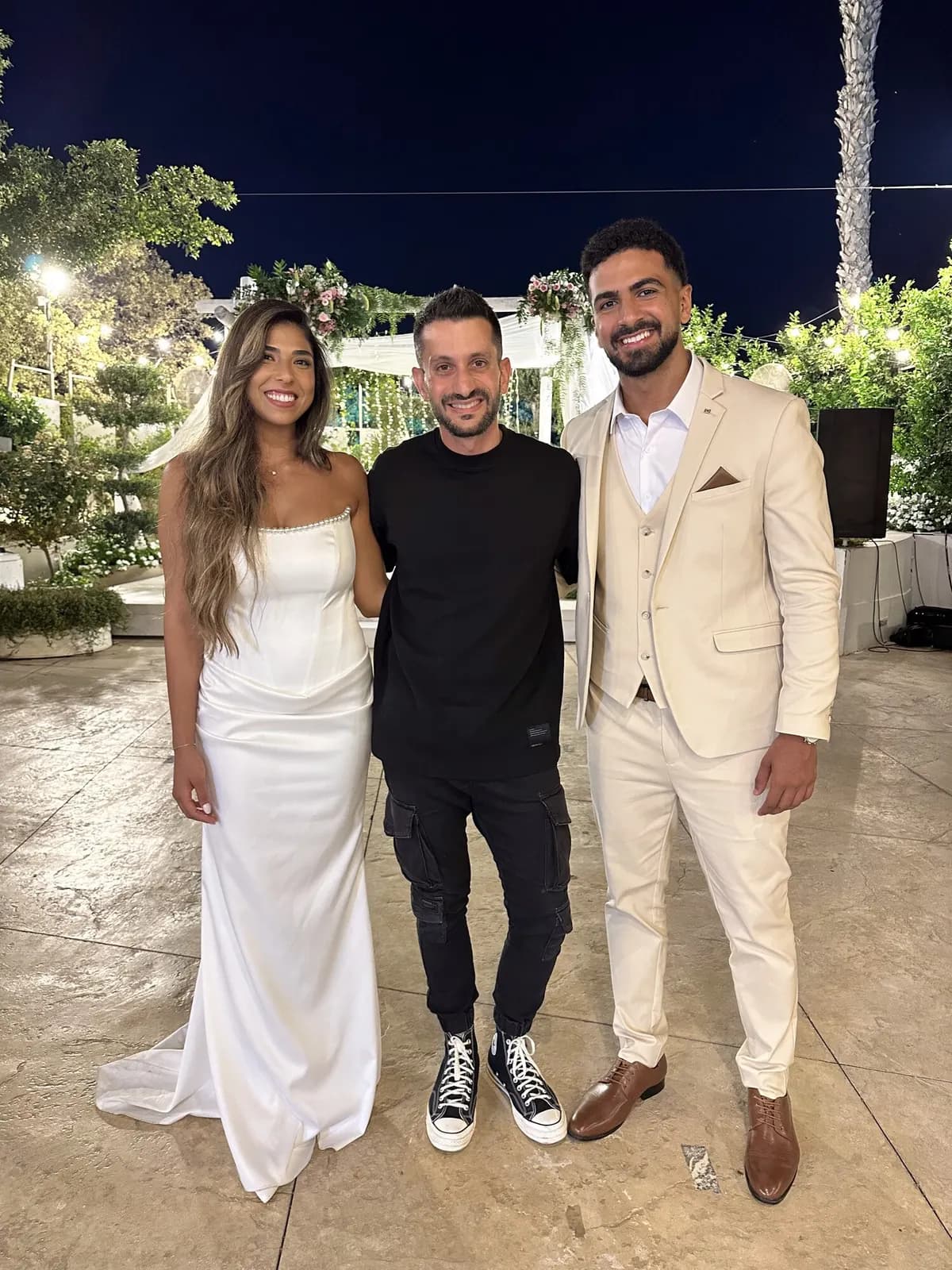 A happy couple with Elkana Paz after the ceremony