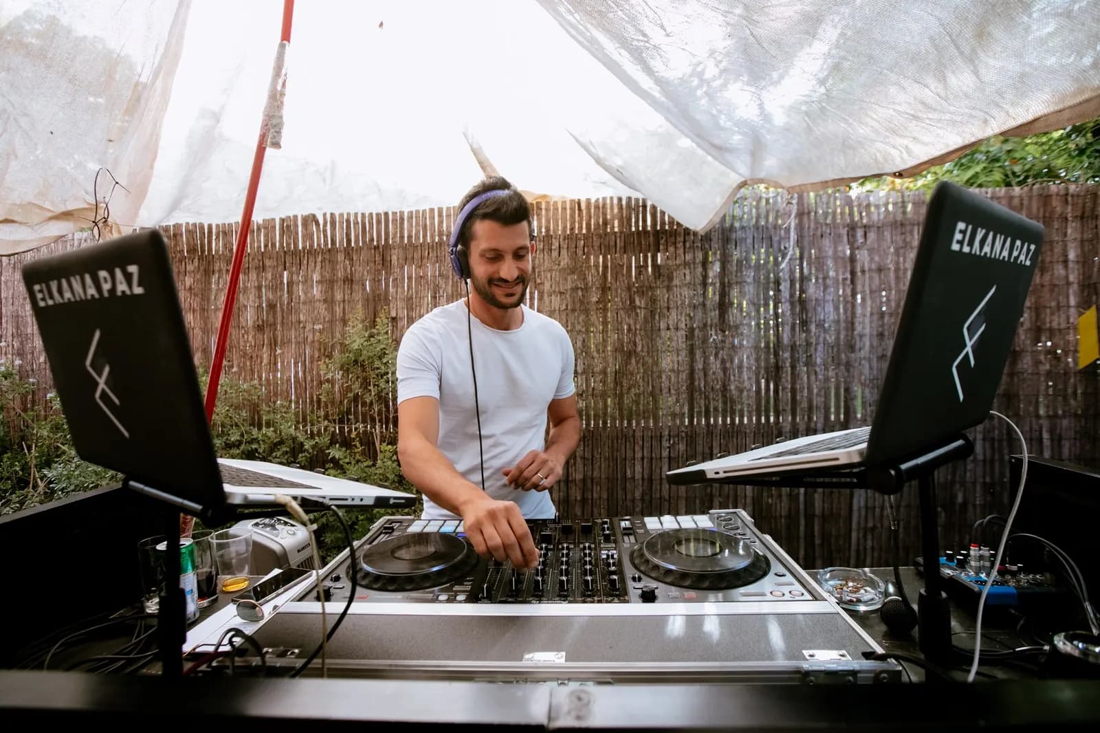 Elkana Paz behind the DJ booth at an event