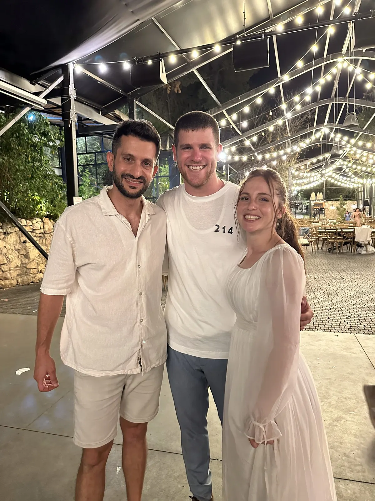 Elkana Paz with a happy couple at their wedding